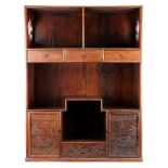 A Chinese hardwood tea cabinet. Of rectangular form with upper and lower rows of drawers and
