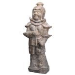 A CHINESE GREY POTTERY FIGURE OF A WARRIOR, TANG DYNASTY (618-907). The figure standing alert