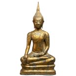 A THAI GILT BRONE FIGURE OF SHAKYAMUNI. The figures seated with legs crossed with hands in