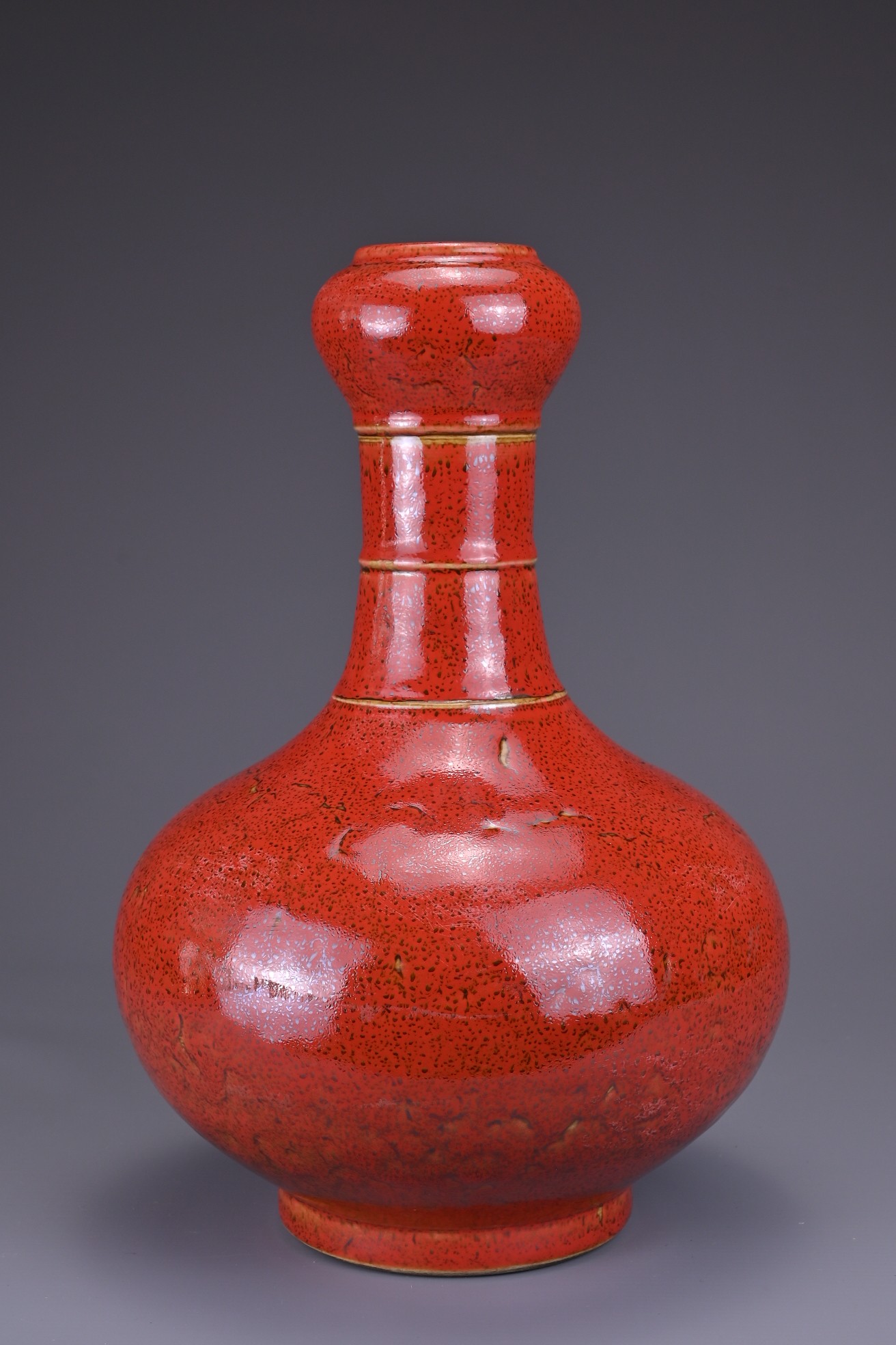 A CHINESE CORAL-GROUND 'GARLIC-MOUTH' VASE. The vase with bulbous body and bamboo form neck - Image 2 of 6