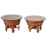 TWO CHINESE WOODEN WASH BASINS with metal bands and glass circular tops. Each standing on five