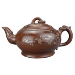 A CHINESE YIXING POTTERY TEAPOT, 20TH CENTURY. The body and cover with raised cherry blossom