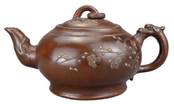 A CHINESE YIXING POTTERY TEAPOT, 20TH CENTURY. The body and cover with raised cherry blossom