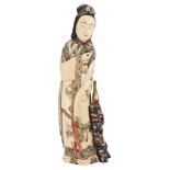 A LARGE CHINESE PAINTED IVORY FIGURE OF LADY. Dressed in a phoenix robe holding a flower standing