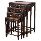 A NEST OF FOUR CHINESE ROSEWOOD OCCASIONAL TABLES, 19TH CENTURY. Each of rectangular form with