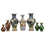 GROUP OF SEVEN CHINESE CLOISONNE VASES. All with floral decoration. 13cm - 33cm tall. (7)