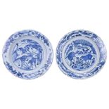 TWO CHINESE BLUE AND WHITE KRAAK PORCELAIN DISHES, 17TH CENTURY. Both with lobed rims decorated with