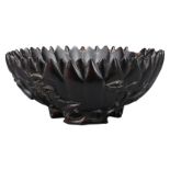 A CHINESE CARVED HARDWOOD 'CHRYSANTHEMUM LOTUS' BOWL. The bowl carved with ribbed petal body, with