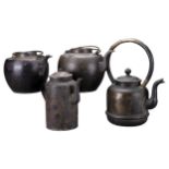FOUR CHINESE METAL POTS, 19/20TH CENTURY. Each with handles, spouts and covers. Tallest pot 30cm