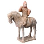 A CHINESE PAINTED POTTERY HORSE & RIDER, NORTHERN QI DYNASTY (550-577). The horse standing on