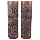 A TALL PAIR OF CHINESE BAMBOO BRUSH POTS, 19TH CENTURY. A mirrored pair each carved in relief with