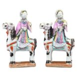PAIR OF CHINESE FAMILLE ROSE PORCELAIN FIGURES, QING DYNASTY. The female figures on horseback