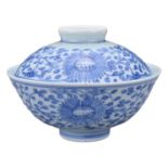 A CHINESE BLUE AND WHITE PORCELAIN BOWL AND COVER, JIAQING PERIOD. Finely potted with floral