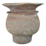 A THAI POTTERY JAR. With rounded crosshatched body on deep, straight foot with an everted rim.