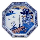 A LARGE JAPANESE IMARI CHARGER, MEIJI PERIOD. Of octagonal form depicting a coastal village scene.