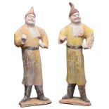 PAIR OF CHINESE PAINTED POTTERY FOREIGN GROOM FIGURES, TANG DYNASTY WITH OXFORD TL TEST. The red