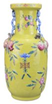 A CHINESE YELLOW GROUND ROULEAU VASE WITH MOULDED DECORATION, 19TH CENTURY. Decorated with sanduo '