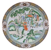 A CHINESE FAMILLE VERTE PORCELAIN DISH, 19TH CENTURY. Decorated with figures travelling through a