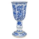 A CHINESE BLUE AND WHITE PORCELAIN GOBLET, KANGXI PERIOD (1662-1722). With floral decoration in