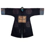 A RARE CHINESE WOMEN'S SURCOAT, FOURTH RANK, QING DYNASTY. The padded black silk coat with front and