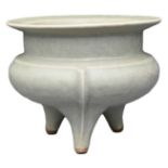 A CHINESE LONGQUAN CELADON TRIPOD CENSER. Covered in a greyish-green celadon glaze. Ming dynasty