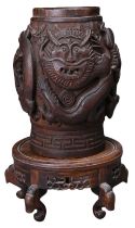 A SOUTHEAST ASIAN CARVED WOOD TOBACCO JAR ON STAND. The jar carved in deep relief with dragons and