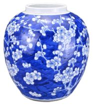 A CHINESE BLUE AND WHITE PORCELAIN PRUNUS JAR, 19TH CENTURY. Of globular form decorated with