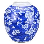 A CHINESE BLUE AND WHITE PORCELAIN PRUNUS JAR, 19TH CENTURY. Of globular form decorated with