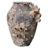 A CHINESE POTTERY JAR WITH ENCRUSTATIONS, POSSIBLY 12/13TH CENTURY. Such shipwreck jars and other