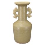 A CHINESE LONGQUAN CELADON MALLET VASE. With twin-fish handles covered in an olive-green glaze. Ming
