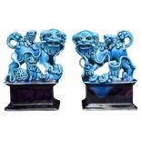 A FINE PAIR OF CHINESE TURQUOISE AND AUBERGINE GLAZED PORCELAIN LION DOGS, QING DYNASTY. The