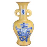 A CHINESE BLUE AND WHITE AND CAFÉ-AU-LAIT TYPE VASE, KANGXI MARK. Of baluster form with twin