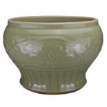 A CHINESE LONGQUAN CELADON JAR, MING DYNASTY. Heavily-potted with lotus decoration above a band of