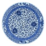 A LARGE CHINESE BLUE AND WHITE PORCELAIN CHARGER, 19TH CENTURY. Decorated with lotus scrolls. Six-