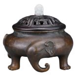 A CHINESE BRONZE 'ELEPHANT' CENSER. The tripod censer with three elephant heads and legs. With