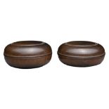 TWO CHINESE HARDWOOD CIRCULAR BOXES AND COVERS. Each of rounded squat from with carved circular band