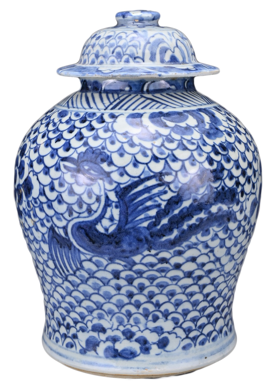 A CHINESE BLUE AND WHITE PORCELAIN PHOENIX JAR AND COVER, 18TH CENTURY. Covered in a scale pattern