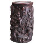 A CARVED WOODEN BRUSH POT WITH 'EUROPEAN FIGURE'. Carved in deep relief with various figures on