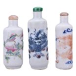 THREE CHINESE PORCELAIN SNUFF BOTTLES, 19/20TH CENTURY. Each of cylindrical form with various