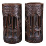 PAIR OF CHINESE BAMBOO BRUSH POTS, 19TH CENTURY. Each carved in relief with figures in bamboo