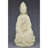 A CHINESE PORCELAIN FIGURE OF GUANYIN
