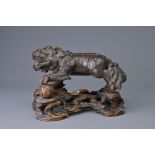 A CHINESE BRONZE MODEL OF DOG OF FO, 18/19TH C