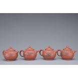 A SET OF FOUR CHINESE YIXING POTTERY TEAPOTS