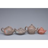 A GROUP OF FOUR CHINESE YIXING POTTERY TEAPOTS