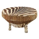 AN AFRICAN ZEBRA-HIDE DRUM-TABLE, 20TH CENTURY