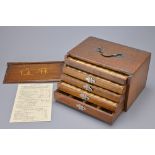 A CHINESE WOODEN CASED MAHJONG SET, EARLY 20TH CENTURY