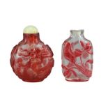 TWO CHINESE GLASS SNUFF BOTTLES. To include a red-overlay glass bottle with dragons and green