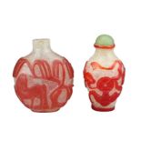 TWO CHINESE GLASS SNUFF BOTTLES. To include a red-overlay glass bottle with horse under a tree.