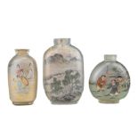 THREE CHINESE INSIDE-PAINTED GLASS SNUFF BOTTLES. Depicting various figures and landscape scenes.