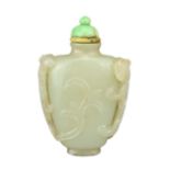 A CHINESE JADE SNUFF BOTTLE, QING DYNASTY. Carved with chilong handles and jade stopper. 6.5cm